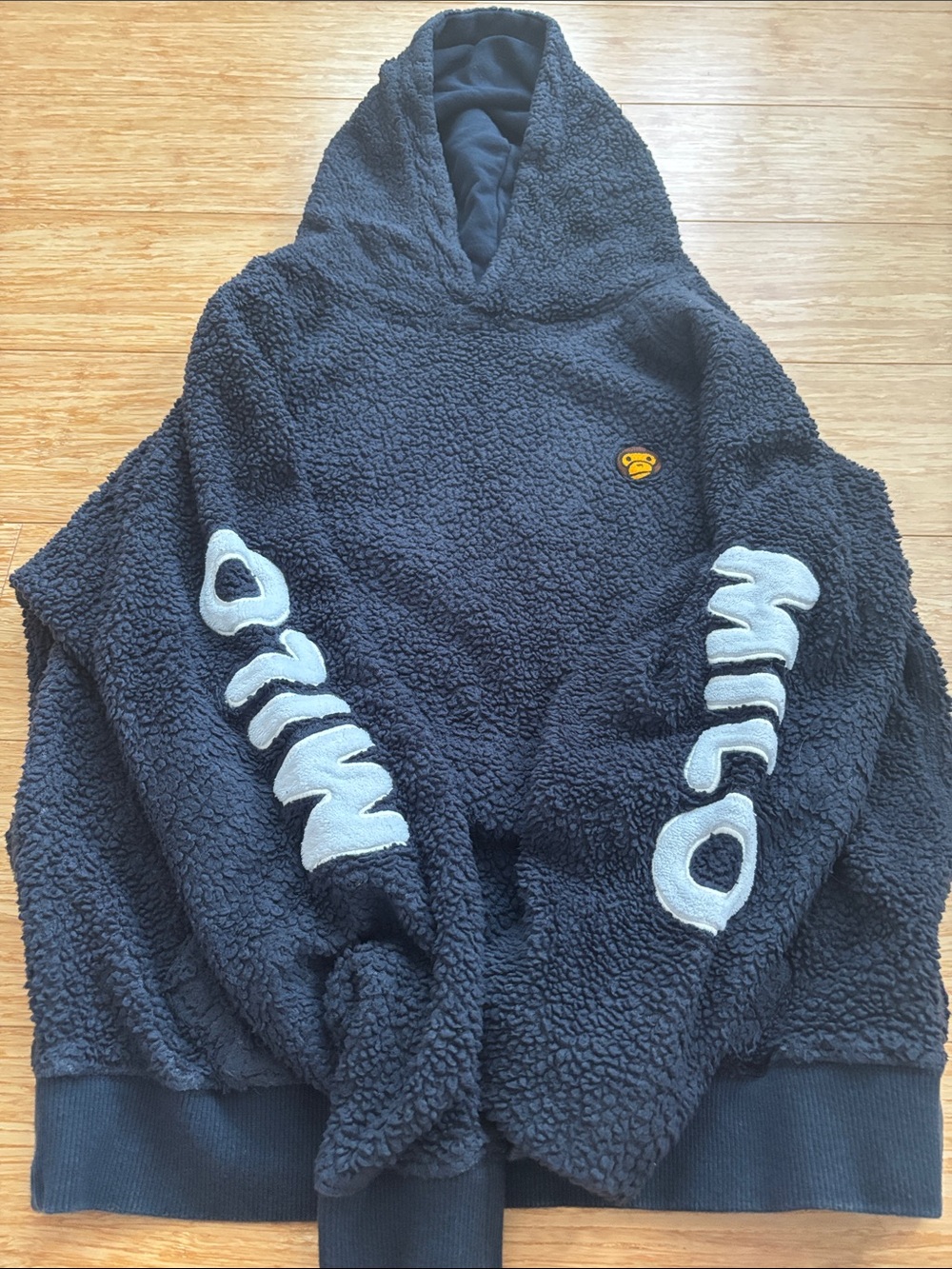 Black Sherpa Hoodie with Contrasting Sleeve Lettering